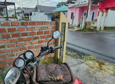 The motorcycle pulled over due to the rain Stock Photos