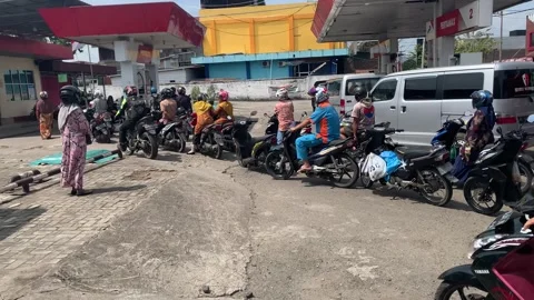 Motorcycle queue at gas station At day Stock Footage 248948179