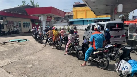 Motorcycle queue at gas station Stock Footage 248948163