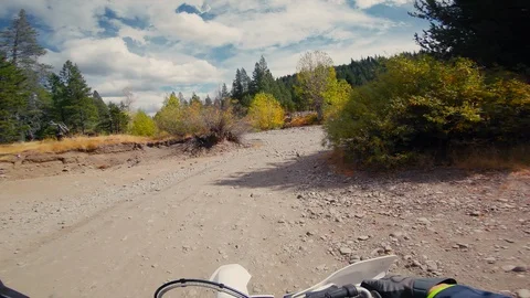 Motorcycle races on forest trail dark tunnel pov action Видео 104104966