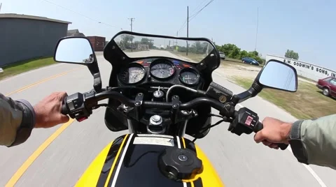 Motorcycle Racing Over Bridge Stock Footage