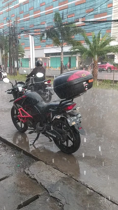 Motorcycle in the rain Stock Footage 246741676