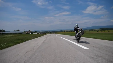 Motorcycle on the rear wheel 库存影片 101979719