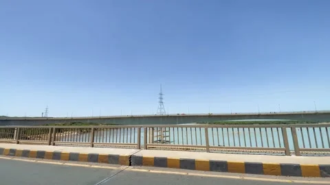 Motorcycle Ride Across Bridge Over Indus River in Khyber Pakhtunkhwa 動画素材 343615293