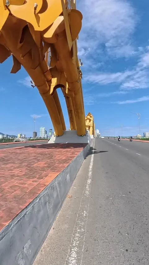 Motorcycle Ride Across Dragon Bridge in Da Nang, Vietnam Stock Footage 344606201