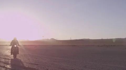 Motorcycle ride through the desert Stock Footage 70324056
