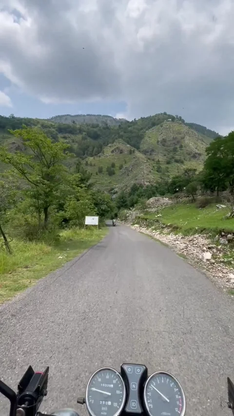 Motorcycle Ride Through Scenic Mountain Roads of Abbottabad KPK Pakistan 스톡 동영상 343613880