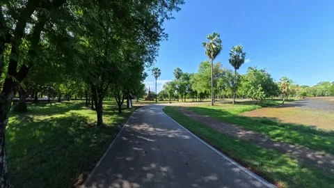 Motorcycle Ride Through Sukhothai Historical Park, Thailand Stock Footage 344907876