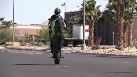 Motorcycle Rider Doing a Back Wheelie on A High Performance Motorcycle 3 Stock-Footage 18970852