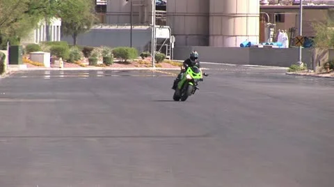 Motorcycle Rider Doing a Front Tire Wheelie on A High Performance Motorcycle Stock-Footage 18970825