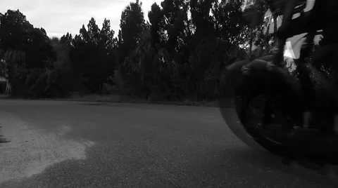 Motorcycle rider flies around corner Vídeos de archivo 45210271