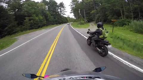 Motorcycle riders communicate pov Stock Footage 56565885