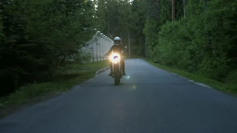 Motorcycle rides on the road Stock Footage 147554388