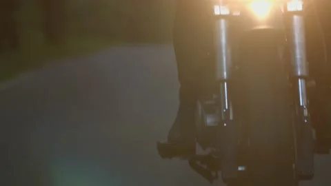 Motorcycle rides on the road in the forest Stock Footage 147554397
