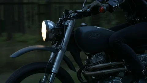 Motorcycle rides on the road in the forest Stock Footage 147554404