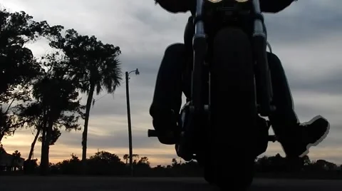 Motorcycle rides straight in to camera Vídeos de archivo 45210144