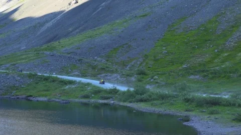 Motorcycle rides through the mountains Stock Footage 280872647