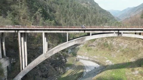 Motorcycle riding the mountain,on a bridge Stock Footage 245139651