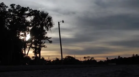 Motorcycle riding by in sunset Stock-Footage 45290950