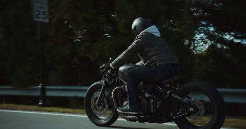 Motorcycle On Road In Trees - 4K Stock Footage 170258564