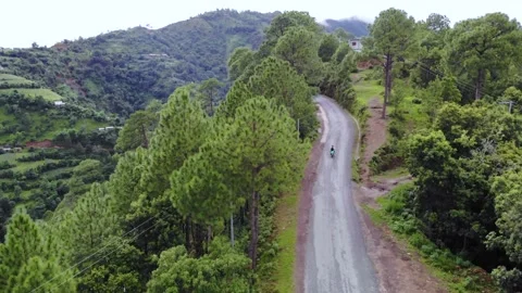 A motorcycle running Oon the mountain road, Aerial video Nepal Stock Footage 155277319