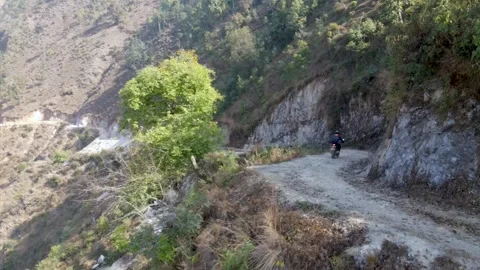 A motorcycle running Oon the mountain off road, Aerial video Nepal Video stock 155367511