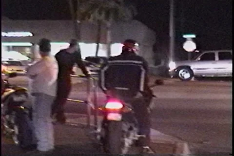 Motorcycle runs from motorcycle cop Stockbeeldmateriaal 7751745