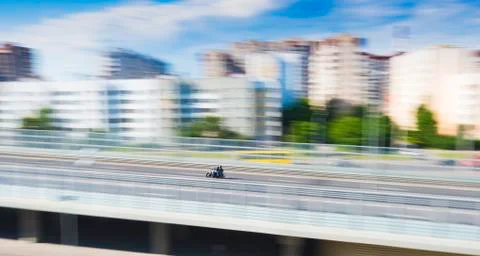 Motorcycle in rush, motion blur effect, panoramic city view Stock Photos