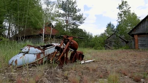 The motorcycle rustles in the rain and sunshine. Eviction of people. Chernobyl Stock Footage 77683416