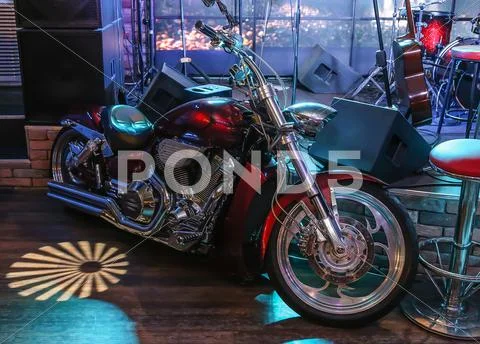 Motorcycle at scene of night bar Stock Photos