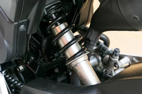 Motorcycle shock absorber a device for absorbing jolts. Stock Photos