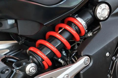 Motorcycle shock absorber a device for absorbing jolts. Stock Photos