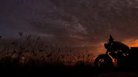 Motorcycle silhouette at sunset time Stock Footage 133924898