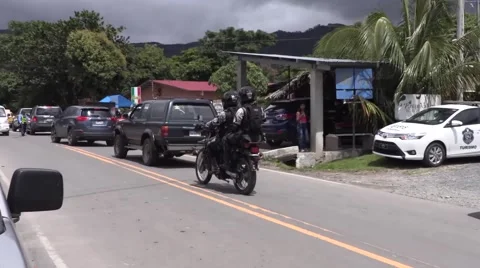Motorcycle sitting in back of traffic jam Video stock 67809276