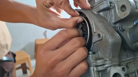 Motorcycle Student Practicing Timing Chain Installation on Engine Stock Footage 328909369