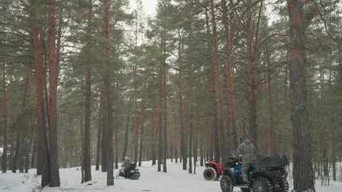 Motorcycle team reviews maps in winter landscape excitement. Outdoor vehicle Stock Footage 332055295