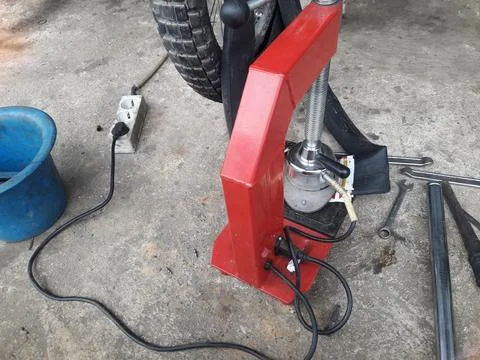 Motorcycle Tire Patching Machine at Repair Workshop 스톡 사진