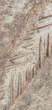 Motorcycle tire pattern on dry ground Photos