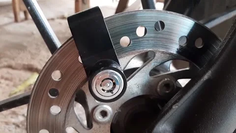 Motorcycle wheel disc lock key or motorcycle padlock Stock Footage 284441413