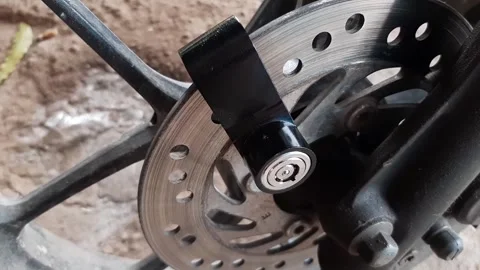 Motorcycle wheel disc lock key or motorcycle padlock Stock Footage 284441418