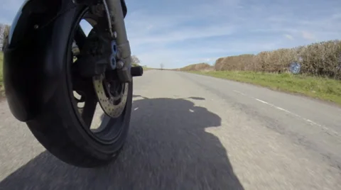 Motorcycle wheel riding down the road Video stock 36591968