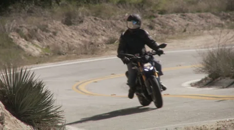 Motorcycles in curve both ways Stock Footage 1066169