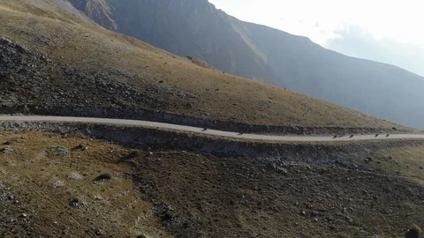 Motorcycles driving through mountains Stock Footage 106947247