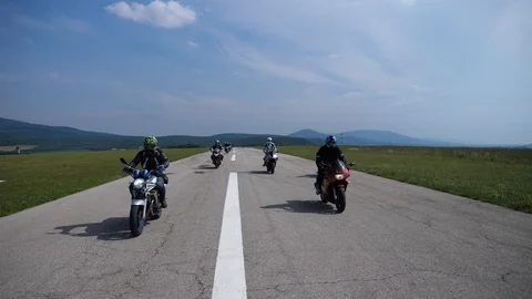 Motorcycles in group on the road Stock Footage 102025807