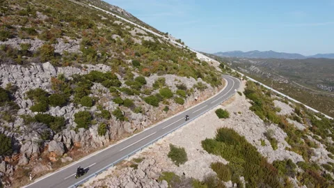Motorcycles on a mountain road Stock Footage 168886699