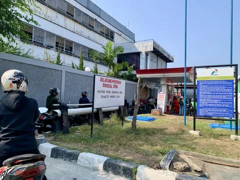 Motorcycles Queue at Pertamina Fuel Station in Jakarta Indonesia Stock Photos