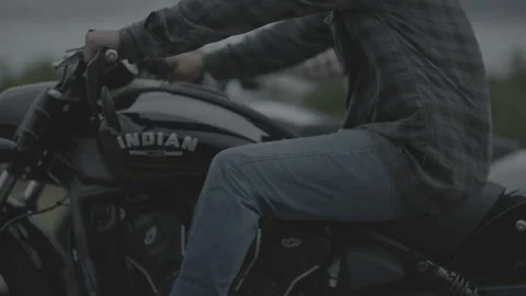 Motorcycles riding down the road in the rain Stock Footage 323478372
