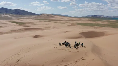 Motorcycles on a sand dune in Western Mongolia. Stock Footage