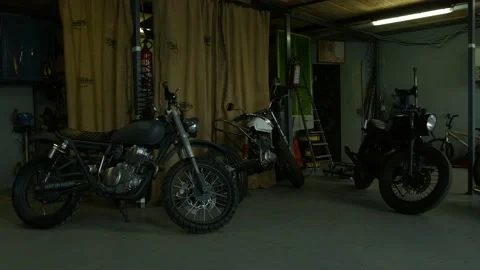 Motorcycles stand in the workshop Stock Footage 147554373