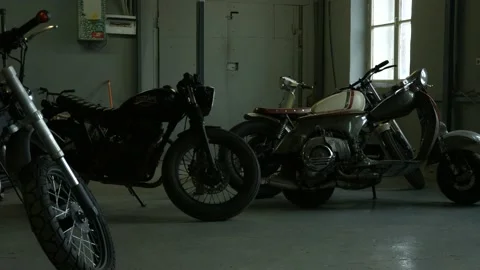 Motorcycles stand in the workshop Stock Footage 147554381